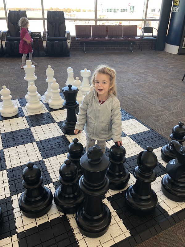 Family amenities at XNA include a giant chess board